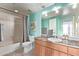 Bathroom with turquoise walls, a single sink, a shower over bath, and a jazz poster at 14250 W Wigwam Blvd # 722, Litchfield Park, AZ 85340
