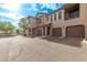 Exterior view of the garages of a townhouse at 14250 W Wigwam Blvd # 722, Litchfield Park, AZ 85340