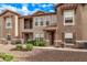 Attractive townhome showcasing a private balcony and landscaped front yard at 14250 W Wigwam Blvd # 722, Litchfield Park, AZ 85340