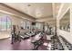 Bright fitness center featuring treadmills, elliptical machines, and free weights for a complete workout at 14250 W Wigwam Blvd # 722, Litchfield Park, AZ 85340