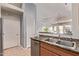 Galley kitchen with stainless steel appliances, wood cabinets, and a double sink at 14250 W Wigwam Blvd # 722, Litchfield Park, AZ 85340