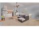 Inviting living room with gray sectional, ceiling fan, and view into the open kitchen at 14250 W Wigwam Blvd # 722, Litchfield Park, AZ 85340