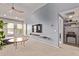 Open-concept living room with a TV, stylish decor, and plenty of natural light at 14250 W Wigwam Blvd # 722, Litchfield Park, AZ 85340