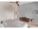 Peaceful main bedroom with a ceiling fan and a door to the ensuite at 14250 W Wigwam Blvd # 722, Litchfield Park, AZ 85340