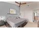 Comfortable main bedroom with a neutral color palette and ceiling fan at 14250 W Wigwam Blvd # 722, Litchfield Park, AZ 85340