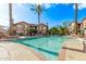 Inviting community pool area with clear blue water, surrounded by well-maintained landscaping at 14250 W Wigwam Blvd # 722, Litchfield Park, AZ 85340