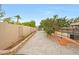 Backyard features brick pavers, pool with fence, trampoline, mature trees, and beautiful landscaping at 1444 E Myrna Ln, Tempe, AZ 85284