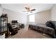Well lit bedroom featuring ceiling fan, neutral walls, and carpeted floor at 1444 E Myrna Ln, Tempe, AZ 85284