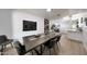 Spacious dining area showcases a modern table with seating for six, enhanced by natural light and stylish decor at 1444 E Myrna Ln, Tempe, AZ 85284