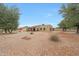 Expansive desert landscaped front yard features a circular driveway that leads to the covered front patio at 1444 E Myrna Ln, Tempe, AZ 85284