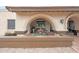Covered front patio featuring a fountain and tiled brick flooring and desert rock landscape at 1444 E Myrna Ln, Tempe, AZ 85284