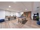 Basement game room featuring a kitchenette, bar seating, and foosball table at 1444 E Myrna Ln, Tempe, AZ 85284