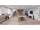 Bright game room with a pool table, shuffleboard, and stone fireplace at 1444 E Myrna Ln, Tempe, AZ 85284