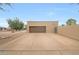 Detached two-car garage with ample parking space in the driveway and side gate at 1444 E Myrna Ln, Tempe, AZ 85284