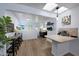 Bright dining room area and kitchen with skylights and sleek island at 1444 E Myrna Ln, Tempe, AZ 85284