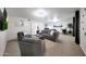 Expansive living space features plush seating, stylish decor, and access to a bedroom for relaxation at 1444 E Myrna Ln, Tempe, AZ 85284