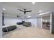 Finished basement with stylish decor; includes large bed, sofa, and entertainment at 1444 E Myrna Ln, Tempe, AZ 85284