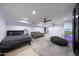 Finished basement with stylish decor; includes large bed, sofa, and entertainment at 1444 E Myrna Ln, Tempe, AZ 85284