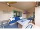 Inviting covered patio featuring comfortable seating and a cozy fire pit table, perfect for outdoor relaxation at 1444 E Myrna Ln, Tempe, AZ 85284