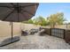 Charming patio with stone pavers, shaded seating area with comfortable furniture, and a relaxing ambiance at 1444 E Myrna Ln, Tempe, AZ 85284