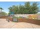 Backyard playground featuring climbing structures, a slide, swings, and a trampoline at 1444 E Myrna Ln, Tempe, AZ 85284