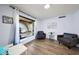 Bright sitting area with hard wood floors with natural light and comfortable chairs at 1444 E Myrna Ln, Tempe, AZ 85284