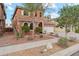 Inviting two-story home with manicured landscaping, rock features, and a cozy exterior aesthetic at 14744 W Poinsettia Dr, Surprise, AZ 85379