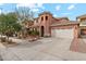 Charming two-story home with a neutral color scheme, three-car garage, and well-maintained landscaping at 14744 W Poinsettia Dr, Surprise, AZ 85379