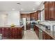 Lovely kitchen with stainless steel appliances, ample counter space, and wood cabinetry at 14744 W Poinsettia Dr, Surprise, AZ 85379