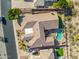 Aerial view of the home with a large backyard and sparkling pool, and a well manicured lawn at 14841 S 6Th Pl, Phoenix, AZ 85048