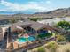 Gorgeous aerial view of a private backyard with sparkling pool and mountain views, with mature landscaping at 14841 S 6Th Pl, Phoenix, AZ 85048
