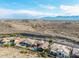 Expansive aerial view showcases a neighborhood, with homes that have beautiful pools, nestled in a scenic desert landscape at 14841 S 6Th Pl, Phoenix, AZ 85048