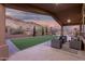 Covered patio with outdoor seating area overlooking the backyard, pool, and mountain views at 14841 S 6Th Pl, Phoenix, AZ 85048