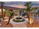 Beautiful backyard fountain with manicured landscaping and desert surroundings at 14841 S 6Th Pl, Phoenix, AZ 85048