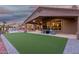 Lush backyard with a pool, outdoor seating, and a well-maintained lawn at 14841 S 6Th Pl, Phoenix, AZ 85048