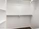 Bright closet with shelving and hanging rods provides ample storage space at 14841 S 6Th Pl, Phoenix, AZ 85048