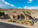 This meticulously landscaped home boasts charming curb appeal in a serene desert setting at 14841 S 6Th Pl, Phoenix, AZ 85048
