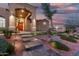 Inviting front entrance with a wood door, desert landscaping, and decorative stone pathway at 14841 S 6Th Pl, Phoenix, AZ 85048