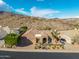 Inviting home with a barrel tile roof, arched entryway, and xeriscaped front yard at 14841 S 6Th Pl, Phoenix, AZ 85048