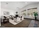 Bright living room featuring a fireplace, comfortable seating, and scenic mountain views through large windows at 14841 S 6Th Pl, Phoenix, AZ 85048
