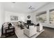 Bright living room with fireplace, large windows, and neutral decor at 14841 S 6Th Pl, Phoenix, AZ 85048