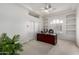 Bright office with a ceiling fan and shelving at 14841 S 6Th Pl, Phoenix, AZ 85048