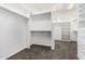 Spacious walk-in closet with custom shelving, drawers, and ample storage space at 14841 S 6Th Pl, Phoenix, AZ 85048