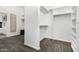 Bright walk-in closet features custom shelving and drawers for organized storage at 14841 S 6Th Pl, Phoenix, AZ 85048