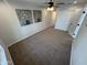 Bedroom with neutral carpet, a ceiling fan, and closet doors at 1545 W Marco Polo Rd, Phoenix, AZ 85027