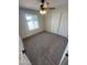 Bedroom with neutral carpet, a ceiling fan, and closet doors at 1545 W Marco Polo Rd, Phoenix, AZ 85027