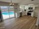 Updated kitchen with white cabinets, stainless steel appliances, quartz countertops, and backyard pool view at 1545 W Marco Polo Rd, Phoenix, AZ 85027