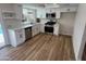 Bright kitchen featuring modern white cabinets, stainless steel appliances, and new countertops at 1545 W Marco Polo Rd, Phoenix, AZ 85027