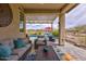 Patio and backyard featuring wicker furniture, a pergola, and a view of the pool at 16139 S 178Th Dr, Goodyear, AZ 85338