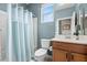 Bathroom showcasing a vanity with a medicine cabinet and a bathtub with shower at 16139 S 178Th Dr, Goodyear, AZ 85338
